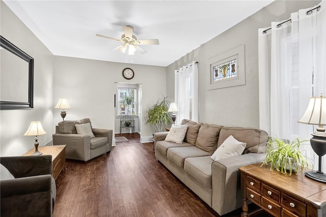 915 Summit St, Mckeesport, PA 15132 - living area with ceiling fan and dark wood-style flooring