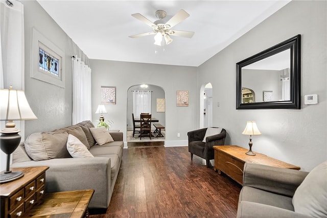 915 Summit St, Mckeesport, PA 15132 - living room with arched walkways, wood finished floors, and a ceiling fan