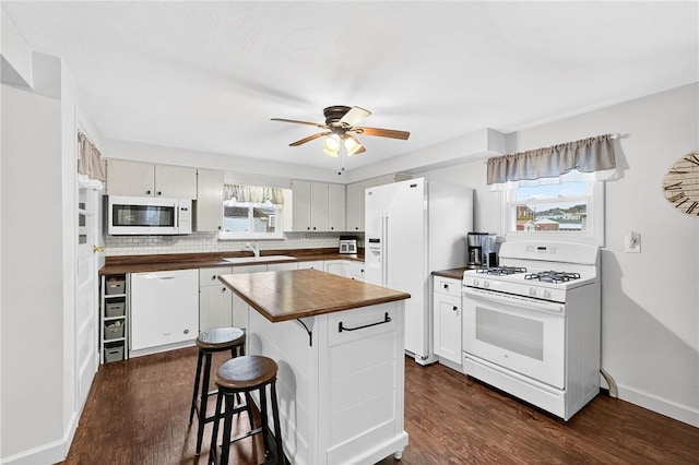 915 Summit St, Mckeesport, PA 15132 - kitchen with white appliances, wood counters, dark wood finished floors, a ceiling fan, and a kitchen island