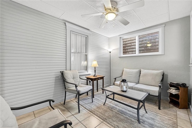 915 Summit St, Mckeesport, PA 15132 - living area with a ceiling fan, light tile patterned floors, and a paneled ceiling
