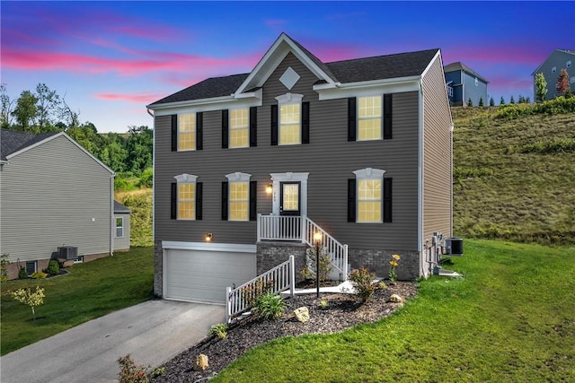 260 Lily Ridge Dr, North Strabane, PA 15317 - view of front of house with driveway, a front yard, and an attached garage