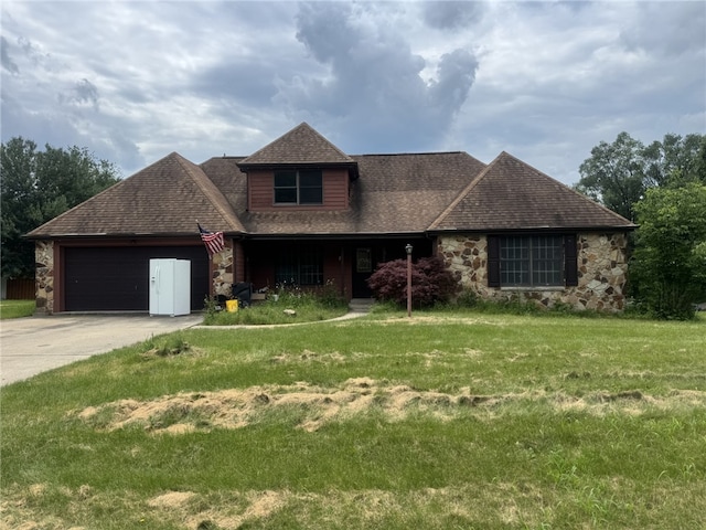 4401 Ridgewood Dr, Jefferson Hills, PA 15332 - view of front of home featuring stone siding, a garage, roof with shingles, and a front lawn
