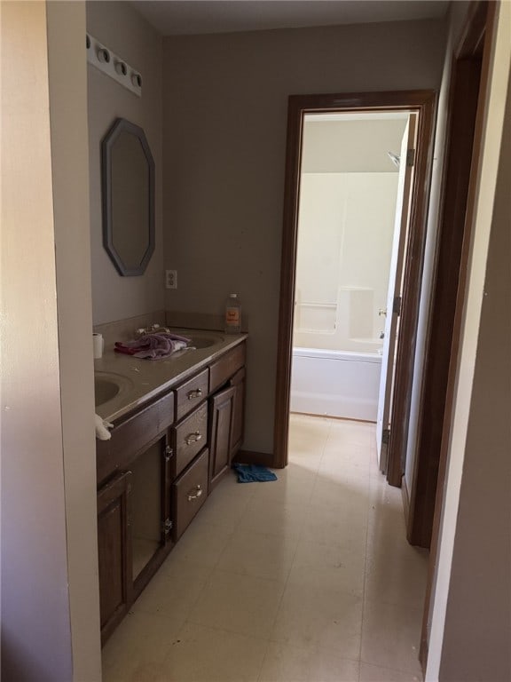 4401 Ridgewood Dr, Jefferson Hills, PA 15332 - bathroom featuring double vanity, a tub to relax in, and tile patterned floors