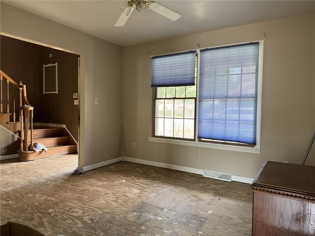 4401 Ridgewood Dr, Jefferson Hills, PA 15332 - unfurnished living room featuring stairway and ceiling fan