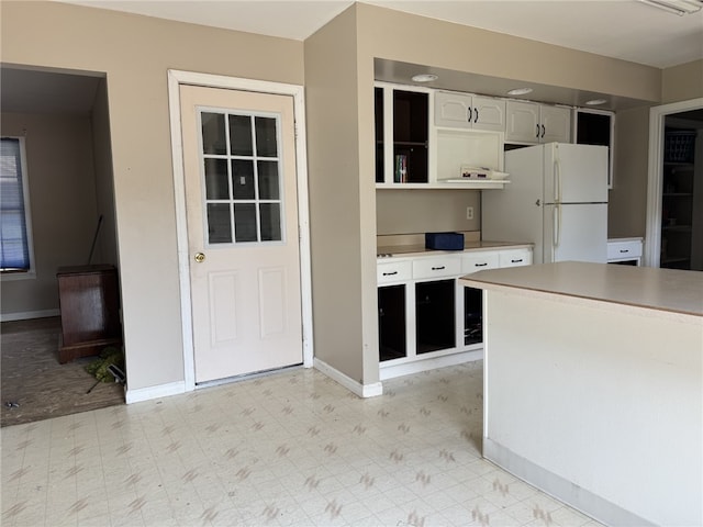 4401 Ridgewood Dr, Jefferson Hills, PA 15332 - kitchen with freestanding refrigerator, light floors, open shelves, and light countertops