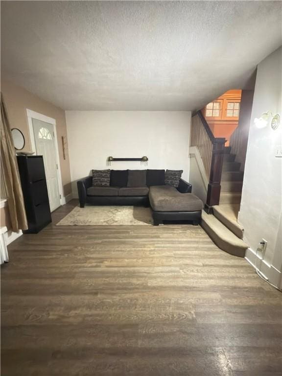 832 Maplewood Ave, Ambridge, PA 15003 - living area featuring stairway, dark wood finished floors, and a textured ceiling