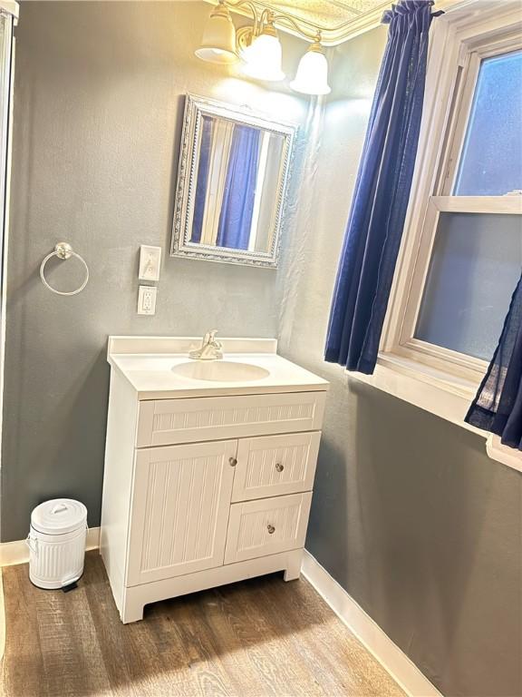 832 Maplewood Ave, Ambridge, PA 15003 - bathroom featuring wood finished floors and vanity