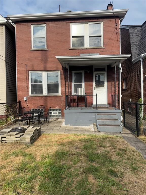 832 Maplewood Ave, Ambridge, PA 15003 - view of front facade with brick siding and a patio area