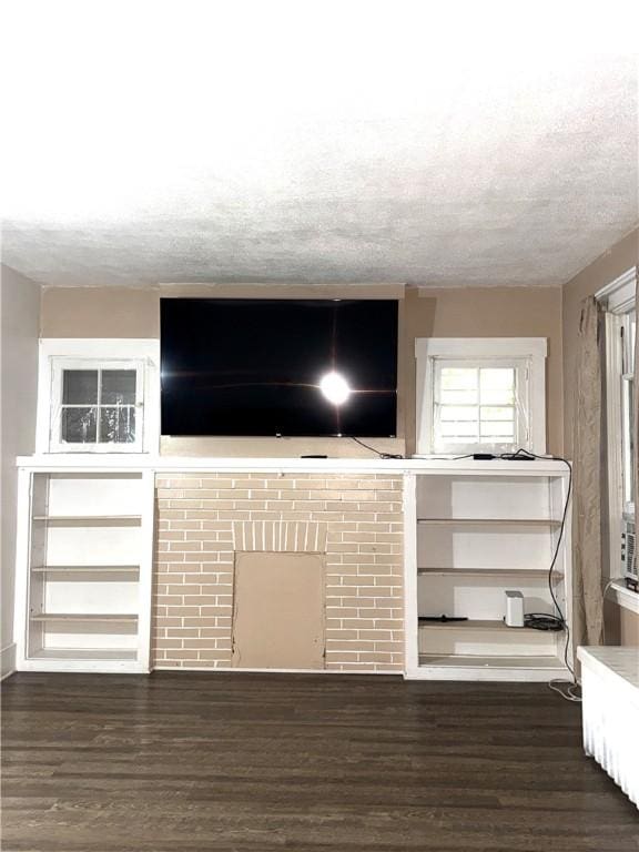 832 Maplewood Ave, Ambridge, PA 15003 - unfurnished living room featuring dark wood-style floors and a textured ceiling
