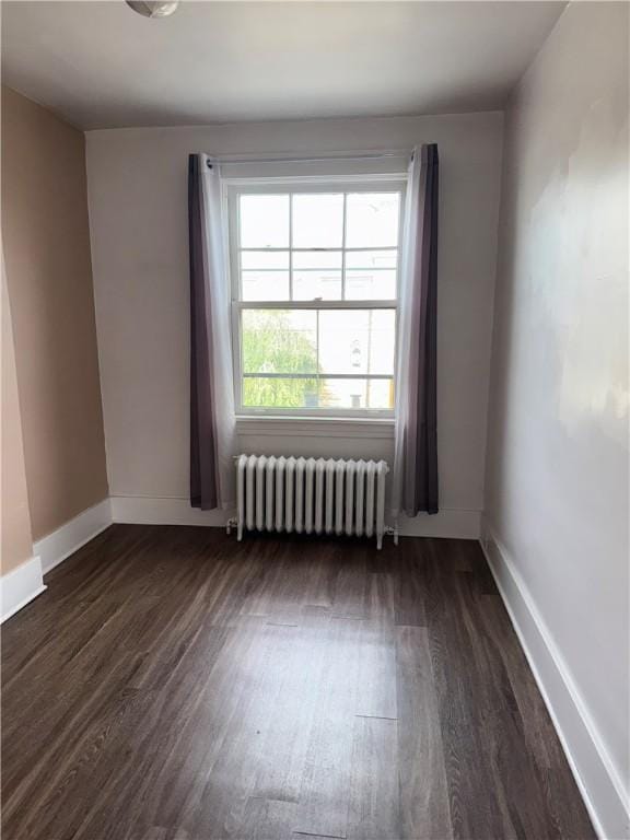 832 Maplewood Ave, Ambridge, PA 15003 - spare room with radiator and dark wood-type flooring