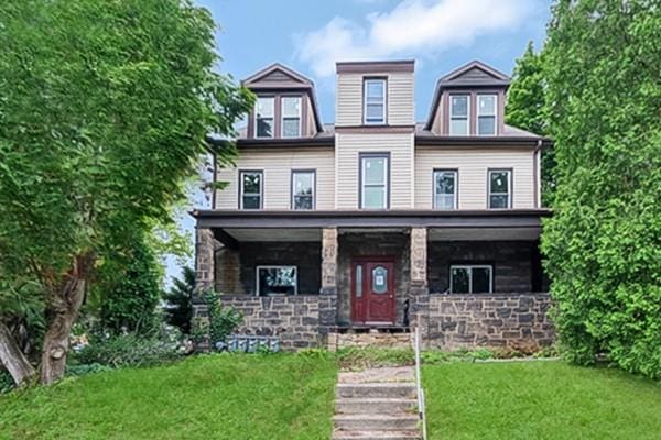 138 Highland Ave, West View, PA 15229 - view of front facade featuring a front lawn, a porch, and stone siding