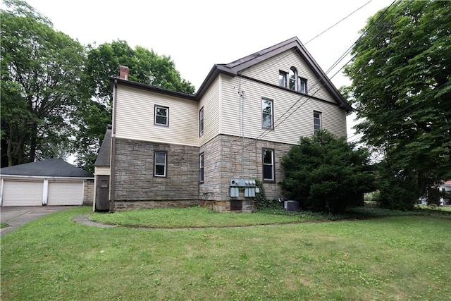 138 Highland Ave, West View, PA 15229 - view of side of property featuring stone siding, a chimney, a garage, a lawn, and an outdoor structure