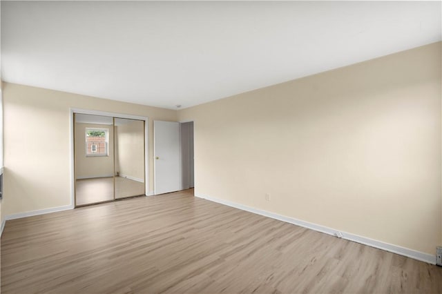 5900 Babcock Blvd Unit 31, Ross Twp, PA 15237 - unfurnished bedroom with light wood finished floors and a closet