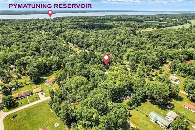 8995 Puritan Ln, Conneaut Twp, PA 16424 - aerial view of property's location with a heavily wooded area and a large body of water