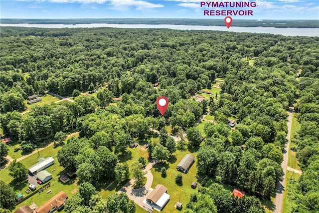 8995 Puritan Ln, Conneaut Twp, PA 16424 - aerial view of a heavily wooded area and a nearby body of water