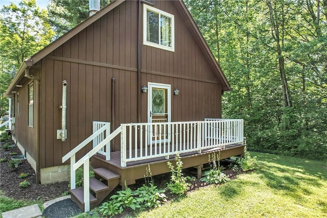 8995 Puritan Ln, Conneaut Twp, PA 16424 - rear view of property with a wooden deck and a lawn