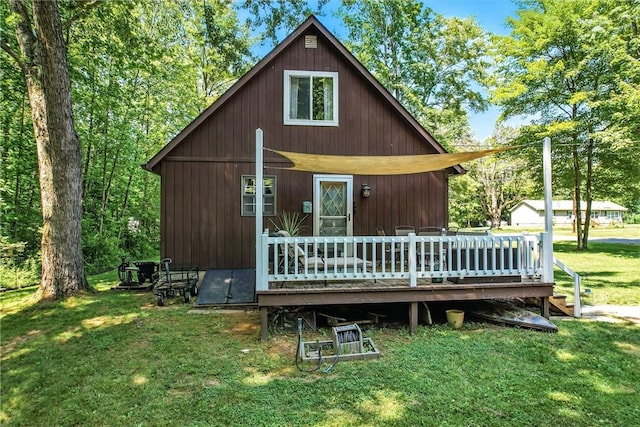 8995 Puritan Ln, Conneaut Twp, PA 16424 - view of front facade with a front lawn and a wooden deck