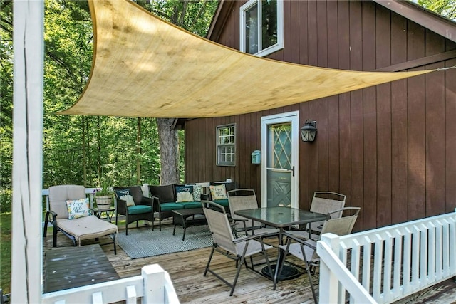 8995 Puritan Ln, Conneaut Twp, PA 16424 - wooden deck featuring an outdoor hangout area and outdoor dining area