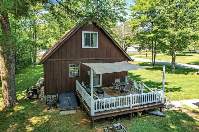 8995 Puritan Ln, Conneaut Twp, PA 16424 - rear view of property with a wooden deck and a yard