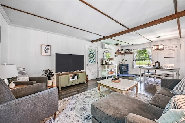 8995 Puritan Ln, Conneaut Twp, PA 16424 - living room featuring a wall unit AC, wood finished floors, and beamed ceiling
