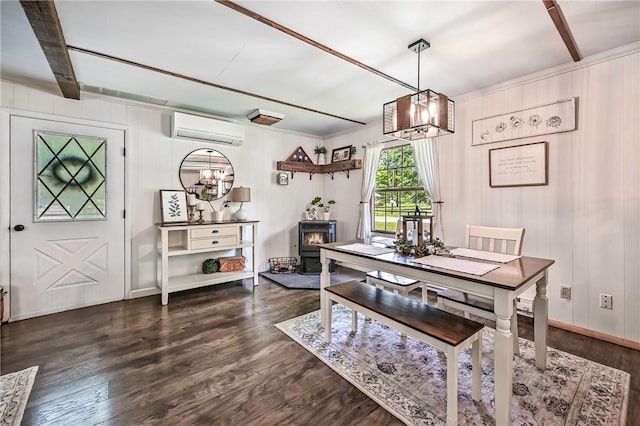 8995 Puritan Ln, Conneaut Twp, PA 16424 - dining room featuring a wall mounted air conditioner, dark wood finished floors, a chandelier, beamed ceiling, and a wood stove
