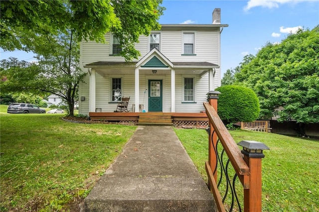 102 Pierce Ave, Sharpsville, PA 16150 - view of front of house featuring covered porch, a chimney, and a front lawn