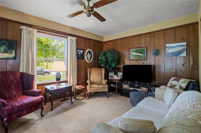 102 Pierce Ave, Sharpsville, PA 16150 - living room with light carpet, wooden walls, and a ceiling fan