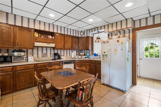 102 Pierce Ave, Sharpsville, PA 16150 - kitchen featuring black appliances, under cabinet range hood, a paneled ceiling, light countertops, and light tile patterned floors