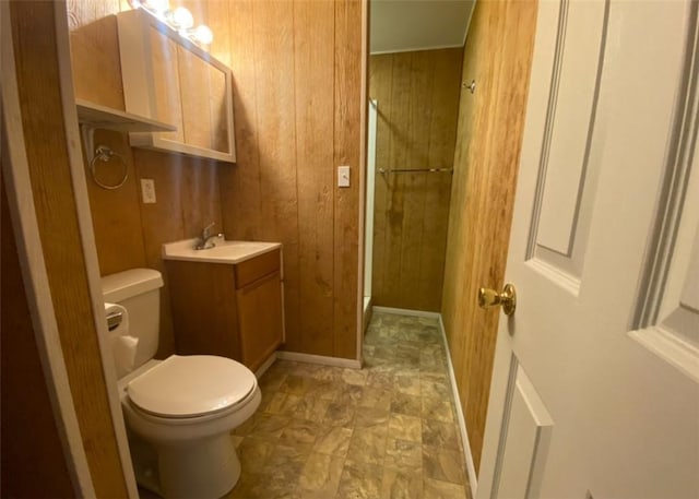 377 Mercer Rd, Hempfield Twp, PA 16125 - bathroom featuring wood walls, vanity, and a shower