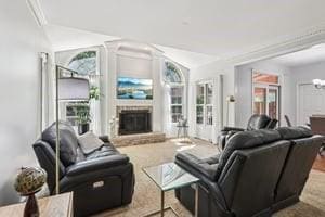 403 Worth Ct, Cranberry Twp, PA 16066 - living area featuring a fireplace with raised hearth and lofted ceiling
