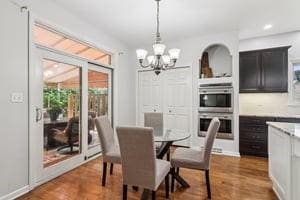 403 Worth Ct, Cranberry Twp, PA 16066 - dining space featuring a chandelier, wood finished floors, and recessed lighting
