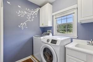 403 Worth Ct, Cranberry Twp, PA 16066 - washroom with washing machine and clothes dryer and cabinet space
