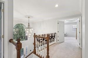 403 Worth Ct, Cranberry Twp, PA 16066 - hall featuring a chandelier, an upstairs landing, crown molding, carpet flooring, and recessed lighting