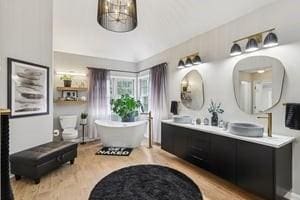 403 Worth Ct, Cranberry Twp, PA 16066 - full bath featuring wood finished floors, a freestanding tub, and double vanity