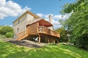 403 Worth Ct, Cranberry Twp, PA 16066 - back of property with a chimney, a deck, and a yard