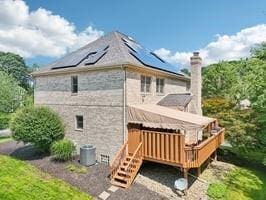 403 Worth Ct, Cranberry Twp, PA 16066 - back of property with solar panels, a chimney, and a deck