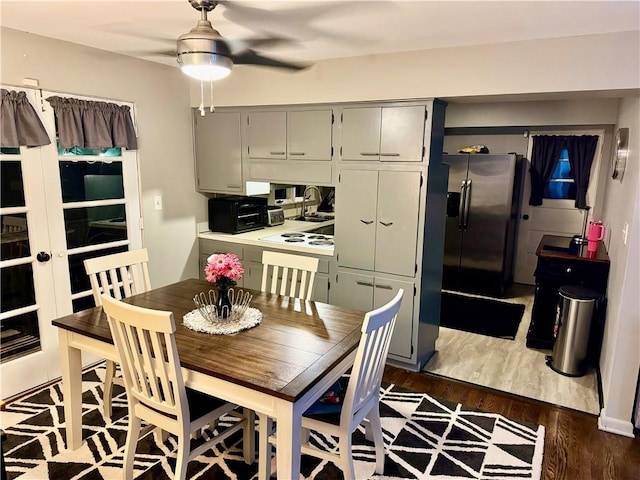 110 Surrey St, Monessen, PA 15062 - dining room with dark wood-style floors and a ceiling fan