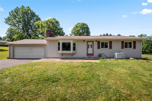 4852 Thomason Rd, South Pymatuning Twp, PA 16150 - ranch-style home with a front yard, a chimney, and driveway