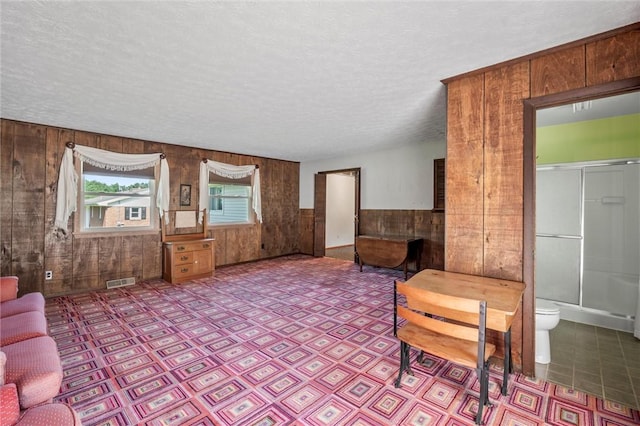 4852 Thomason Rd, South Pymatuning Twp, PA 16150 - living room with wooden walls, a textured ceiling, and wainscoting