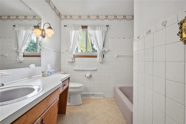 4852 Thomason Rd, South Pymatuning Twp, PA 16150 - full bath featuring tile walls, vanity, tile patterned flooring, and a tub to relax in