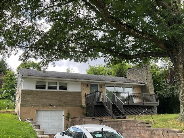 634 Idaho Ave, Verona, PA 15147 - view of front facade featuring a garage, brick siding, a deck, and a chimney
