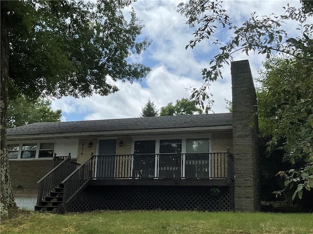 634 Idaho Ave, Verona, PA 15147 - view of front of house featuring brick siding, a chimney, and a deck