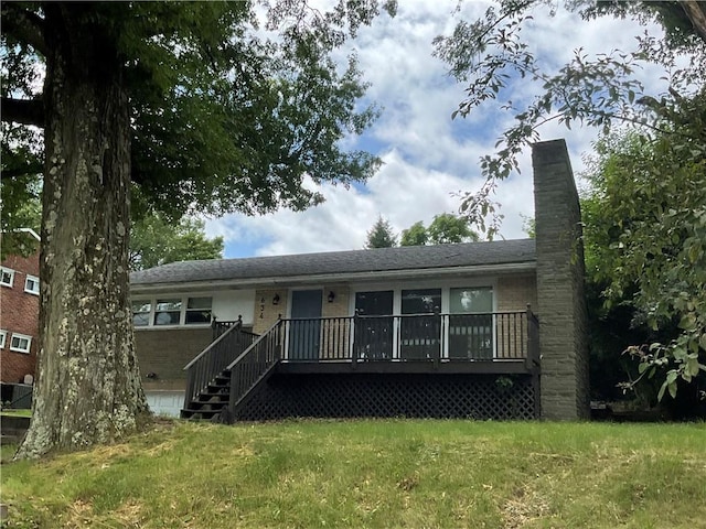 634 Idaho Ave, Verona, PA 15147 - rear view of property with a chimney, brick siding, a lawn, and a wooden deck