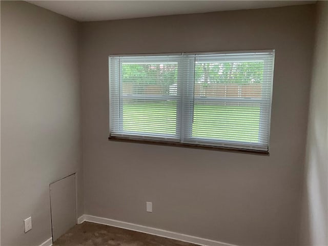 634 Idaho Ave, Verona, PA 15147 - empty room with baseboards and dark colored carpet