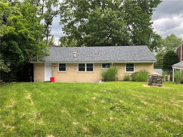 634 Idaho Ave, Verona, PA 15147 - back of house featuring brick siding, a lawn, and a shingled roof