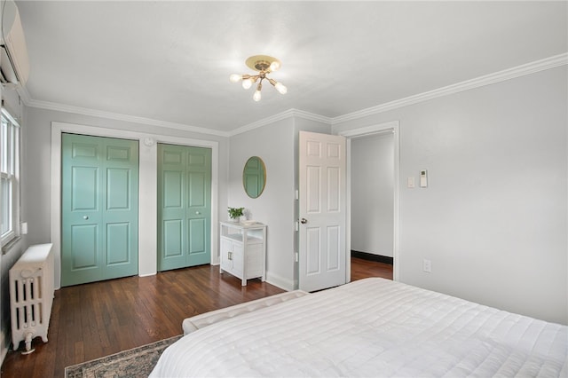 3863 Beechwood Blvd, Greenfield, PA 15217 - bedroom featuring radiator heating unit, dark wood finished floors, a wall mounted air conditioner, multiple closets, and crown molding