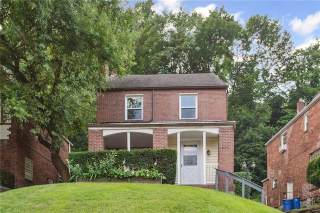 3863 Beechwood Blvd, Greenfield, PA 15217 - view of front facade with brick siding, a front yard, and a shingled roof