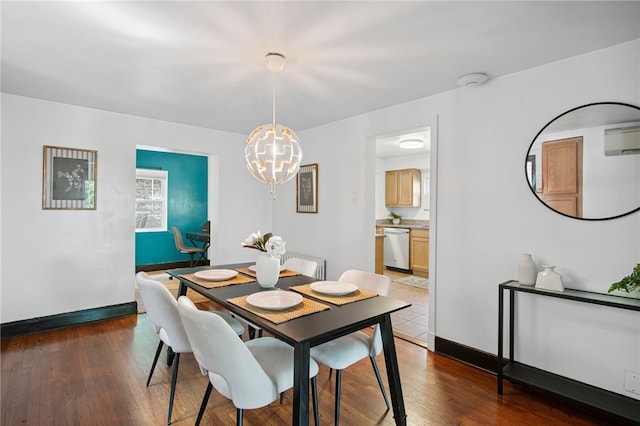 3863 Beechwood Blvd, Greenfield, PA 15217 - dining space featuring a chandelier, a wall mounted AC, and hardwood / wood-style flooring