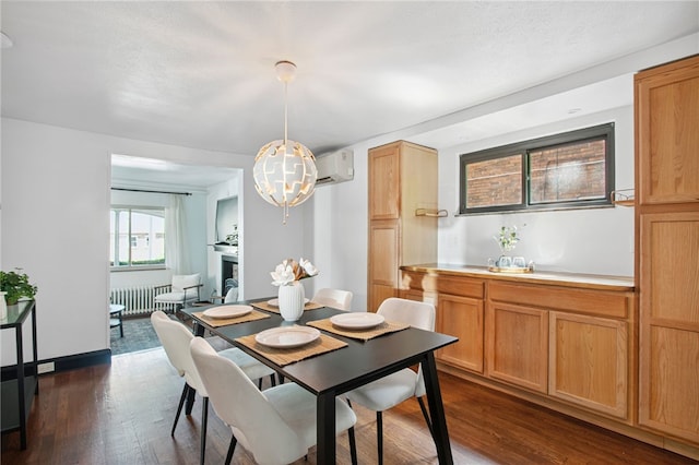 3863 Beechwood Blvd, Greenfield, PA 15217 - dining room with radiator heating unit, dark wood-style flooring, a wall mounted air conditioner, and a chandelier