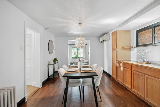 3863 Beechwood Blvd, Greenfield, PA 15217 - dining room with a wall mounted AC, radiator heating unit, a chandelier, and dark wood finished floors